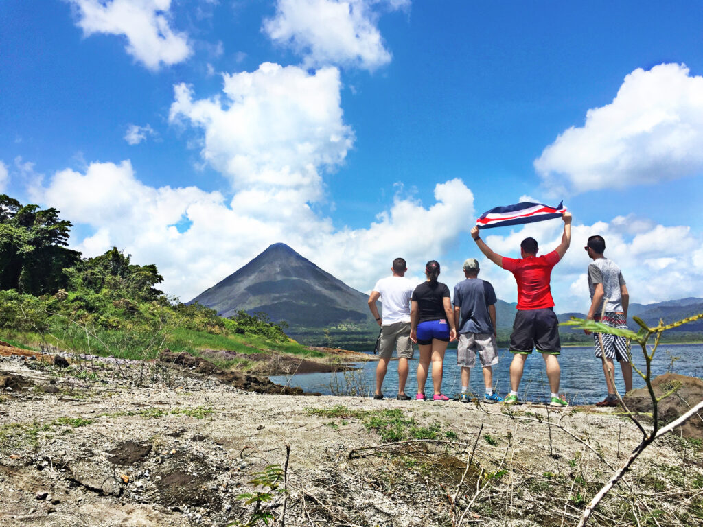 Image of people with Costa Rican flag raised